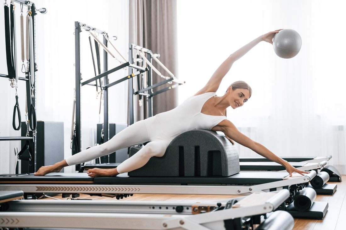 Seated Pilates ring hold for posture alignment Miami