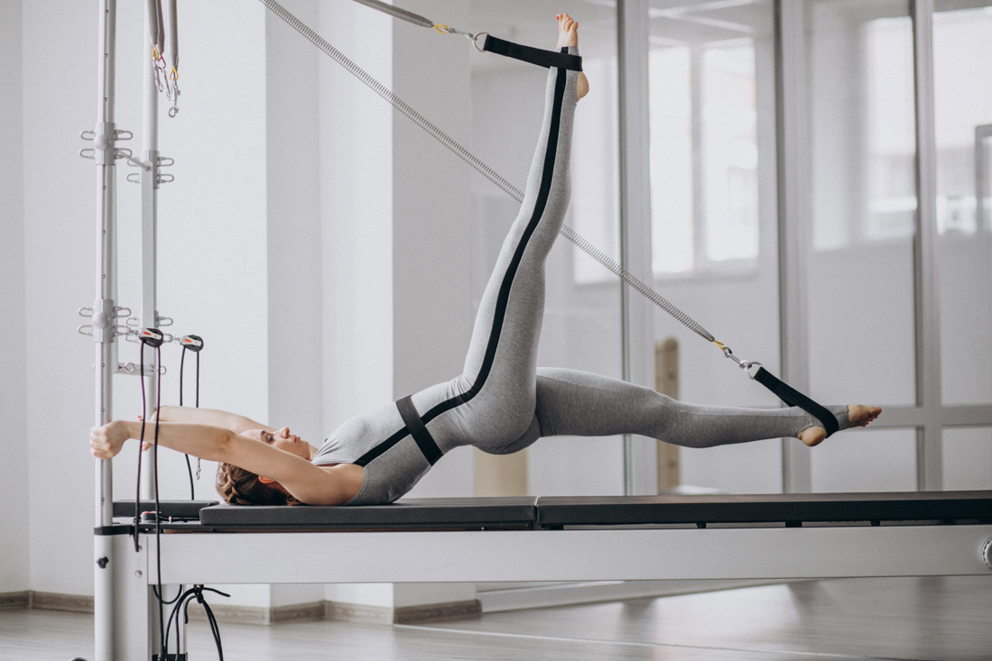 Private Pilates session for back strengthening on reformer