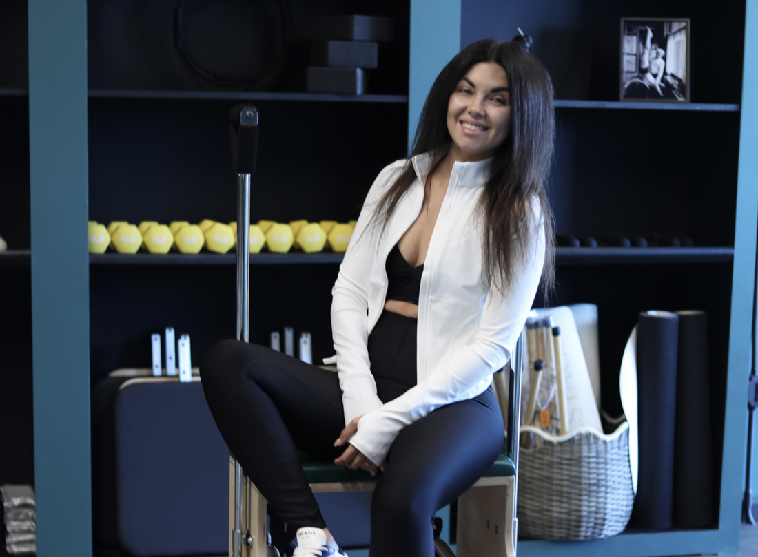 Athlete training core on Pilates reformer in Miami studio